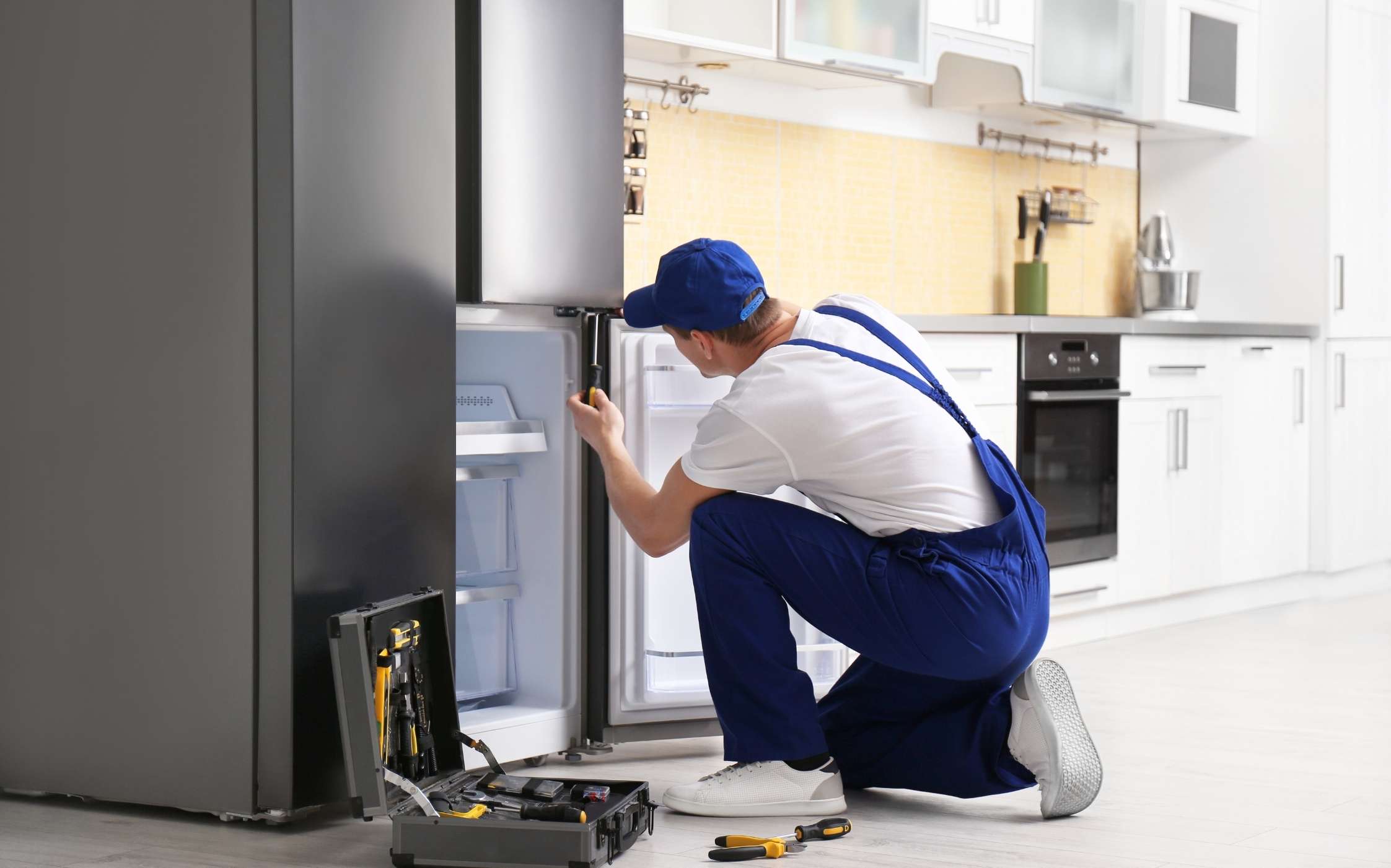 Technician repairing an appliance